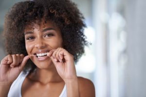 flossing woman