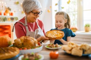 grandmother cooking with child